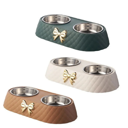 Set of three pet bowls with wooden, green, and beige bases on a white background