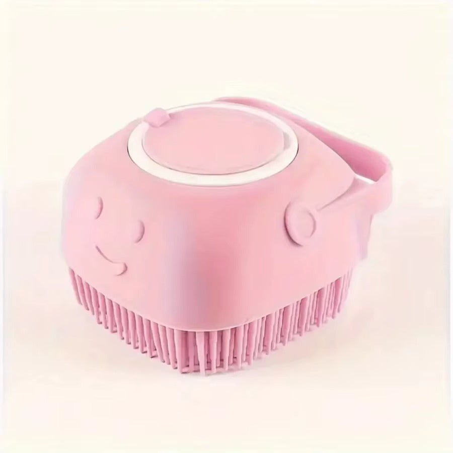 Pink silicone scrubber with smiley face design on a light pink background